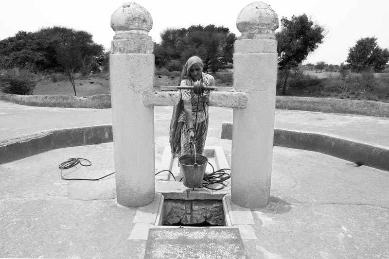 Traditional water supply science and technology of India - Water being collected from a 'kund' (rainwater harvesting tank) in Thar Desert, Bikaner district, Rajasthan